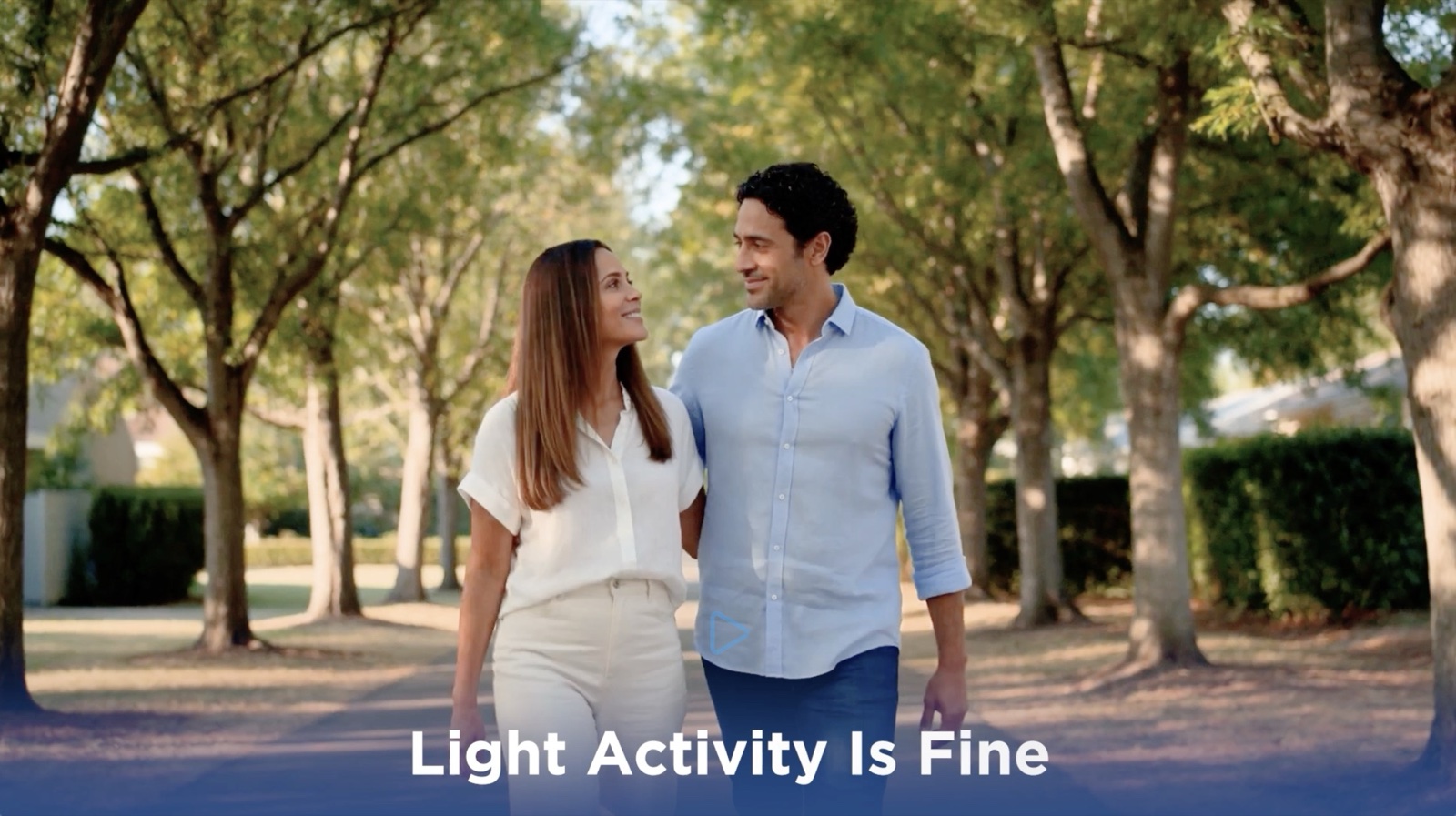 Couple walking outdoors with Light Activity Is Fine super, illustrating approved post-pellet activity