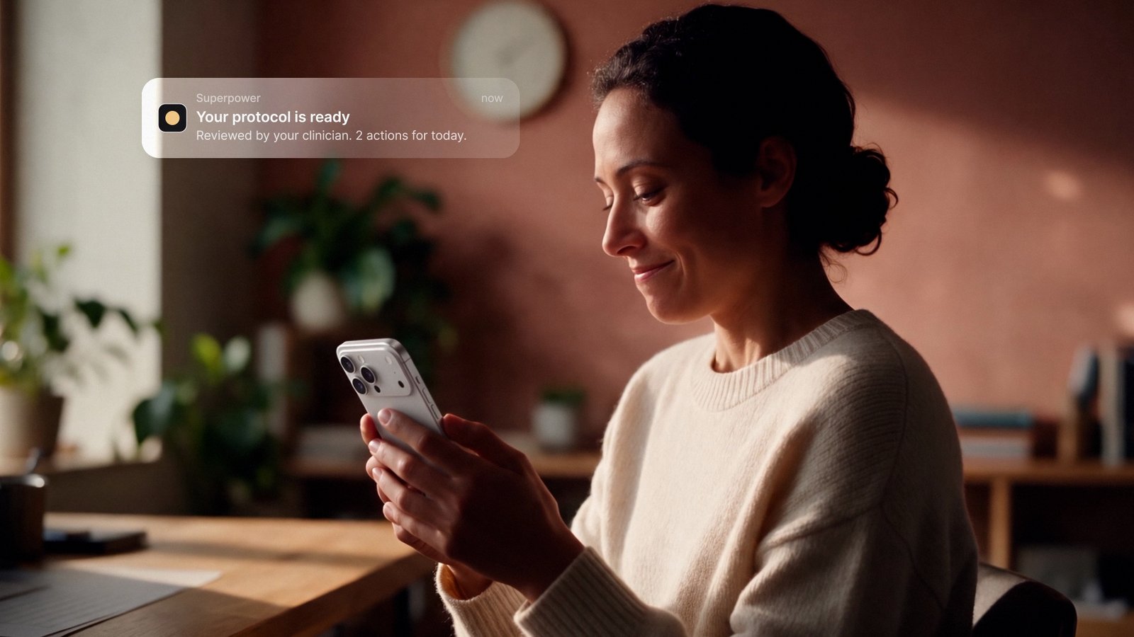 Member reading her Superpower protocol on her phone at home
